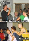 powiększ