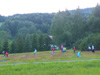 powiększ
