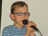 powiększ