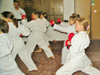 powiększ