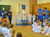powiększ