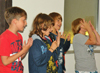 powiększ