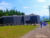 powiększ