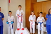 powiększ