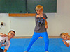 powiększ