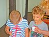 powiększ