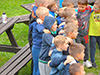 powiększ