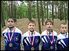 powiększ